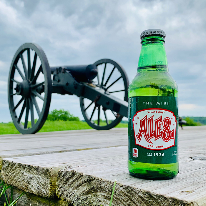 Beer bottle in front of a canyon